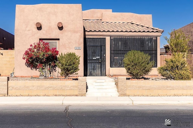 view of pueblo revival-style home