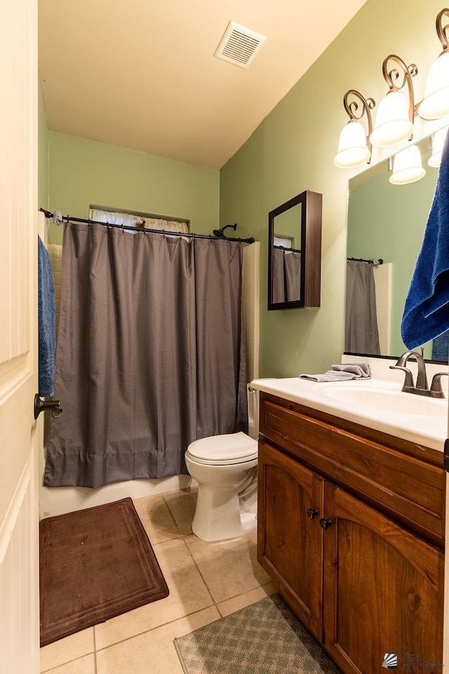 bathroom with tile patterned floors, vanity, and toilet