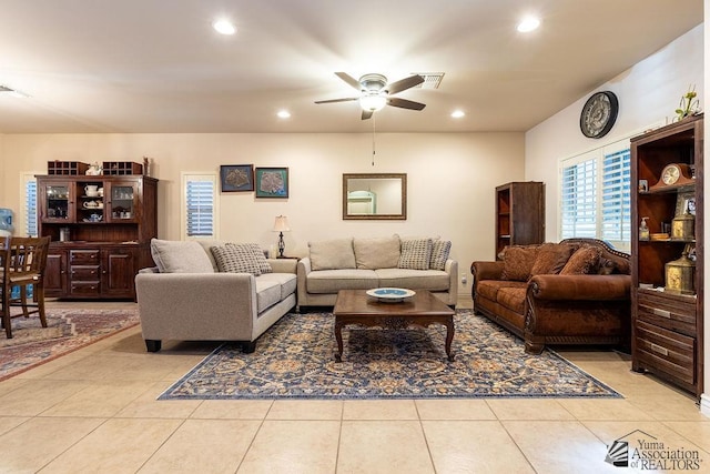 tiled living room featuring ceiling fan