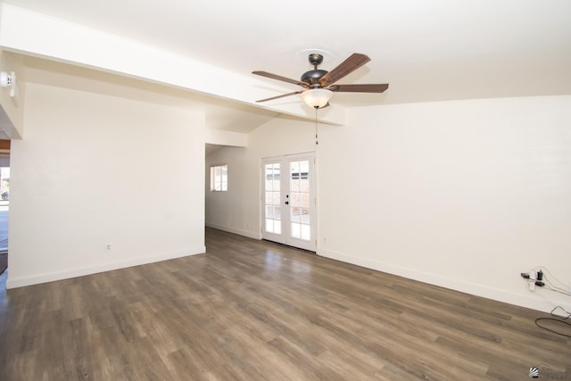 spare room with dark wood-style floors, baseboards, vaulted ceiling, and french doors