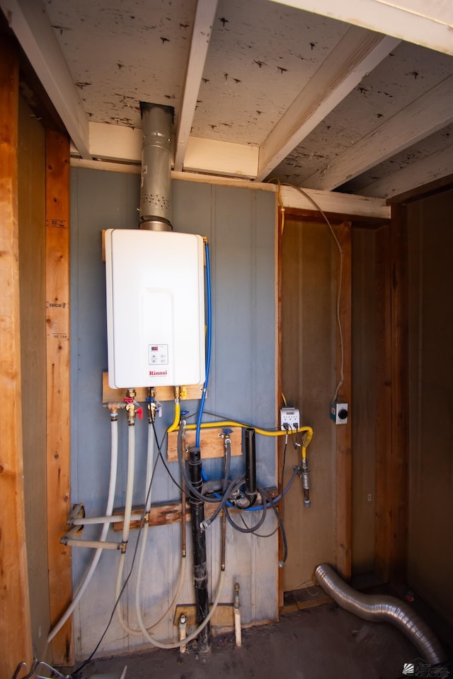 utility room featuring tankless water heater