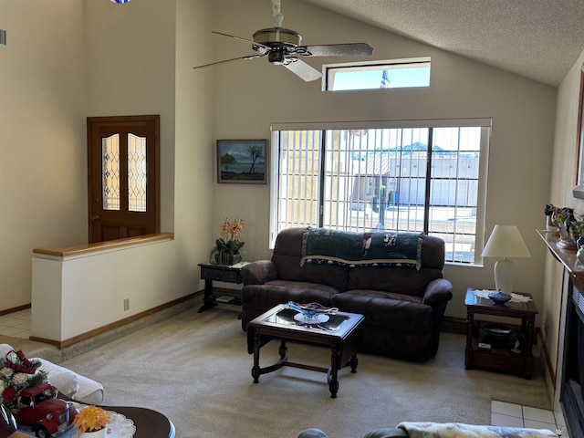 carpeted living room with a textured ceiling and ceiling fan