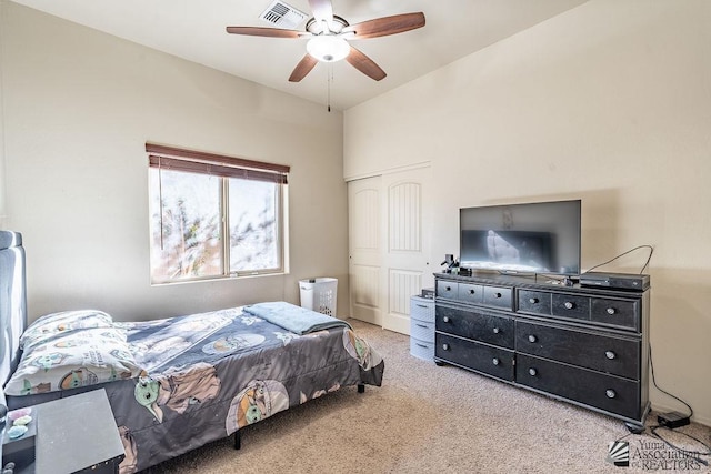 bedroom featuring a closet, carpet flooring, ceiling fan, and visible vents