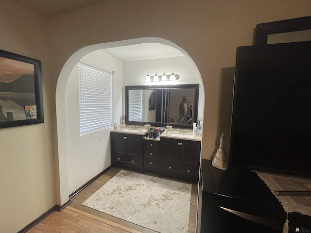 bathroom with wood-type flooring and vanity