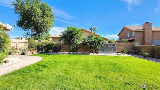 view of yard with a fenced backyard