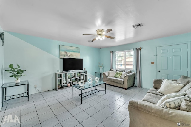 living area with light tile patterned floors, ceiling fan, and visible vents