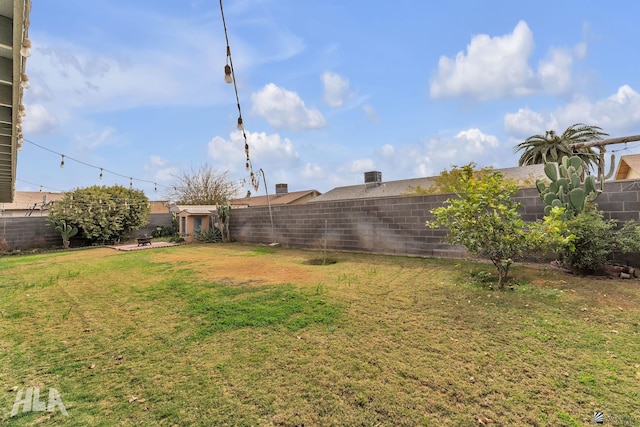 view of yard with a fenced backyard