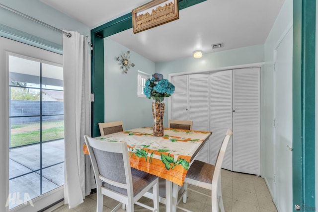 dining area with light floors and visible vents