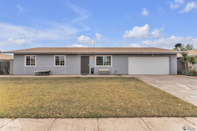 ranch-style house with a garage, concrete driveway, a front lawn, and stucco siding