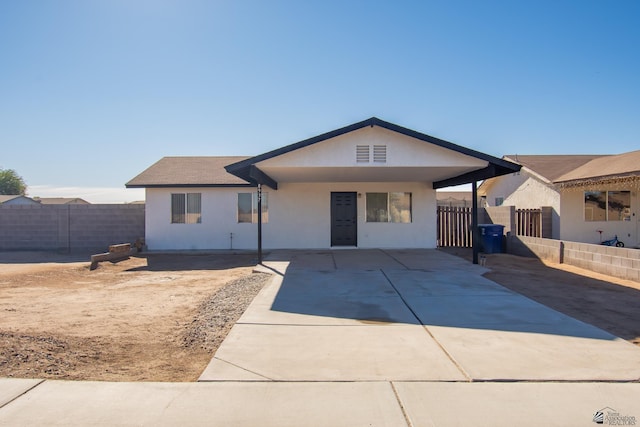 ranch-style house featuring a patio area