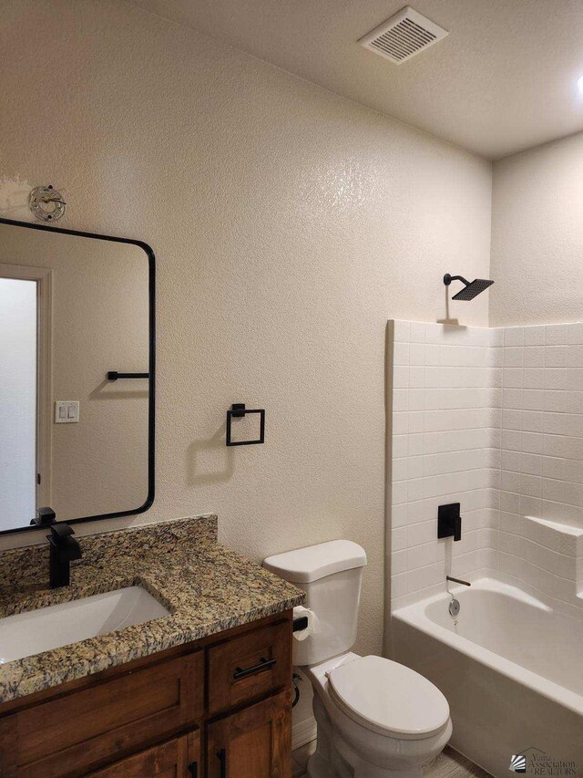 full bathroom with vanity, toilet, and bathtub / shower combination