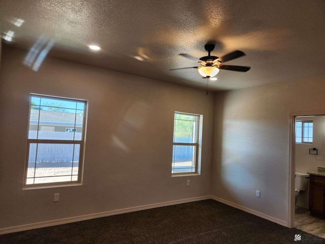 empty room with plenty of natural light and ceiling fan