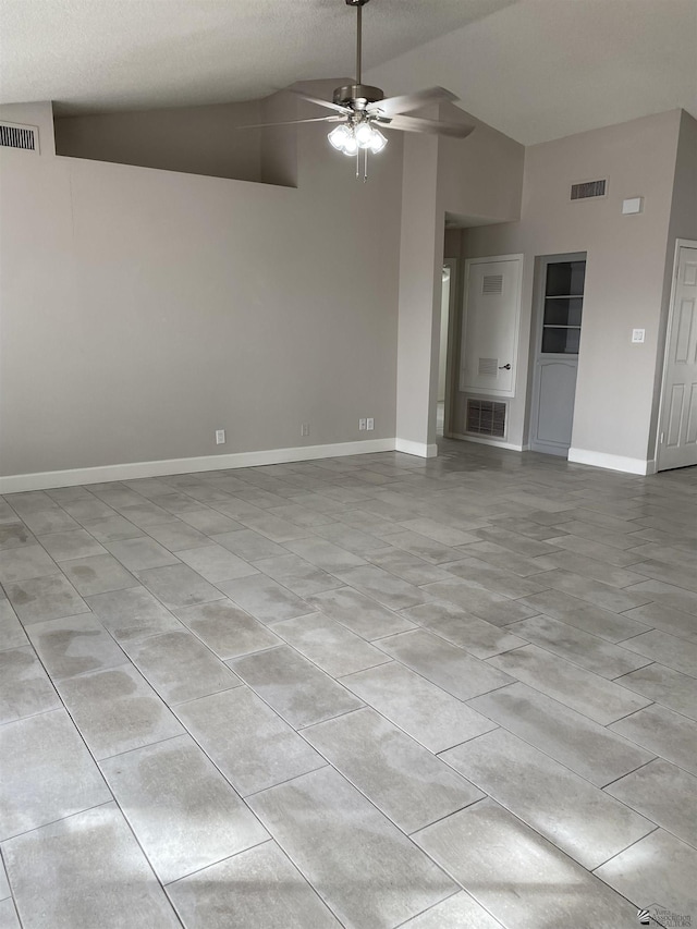 unfurnished living room featuring a textured ceiling, ceiling fan, and lofted ceiling