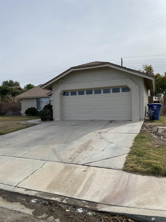 single story home featuring a garage