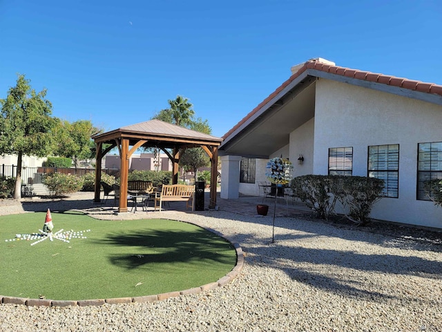 view of yard featuring a gazebo and a patio