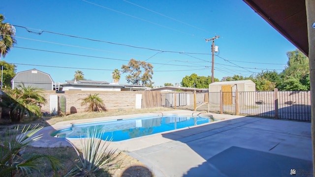 view of swimming pool featuring a storage unit