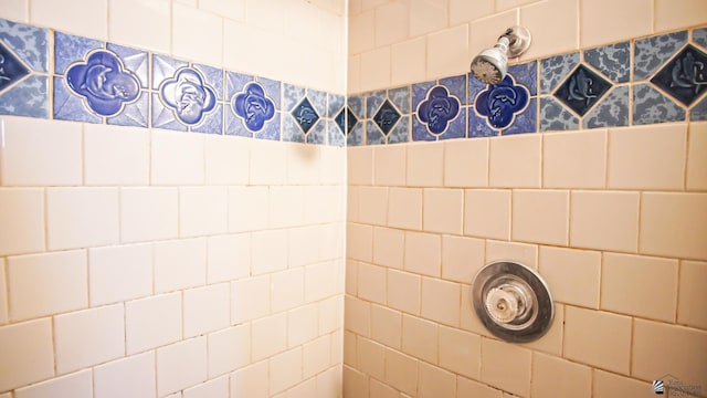 bathroom with tiled shower