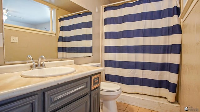 bathroom featuring tile patterned floors, vanity, toilet, and a shower with shower curtain