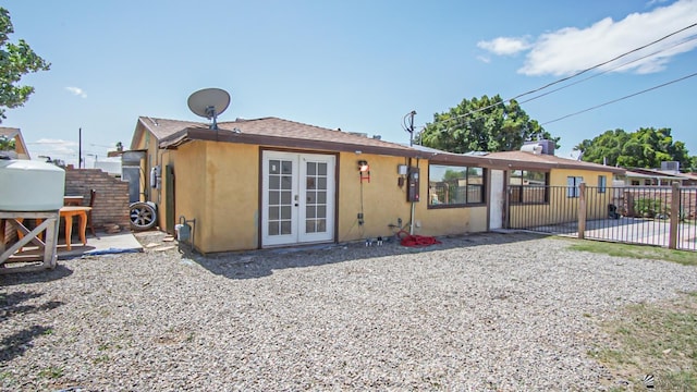 view of front facade with a patio area and french doors