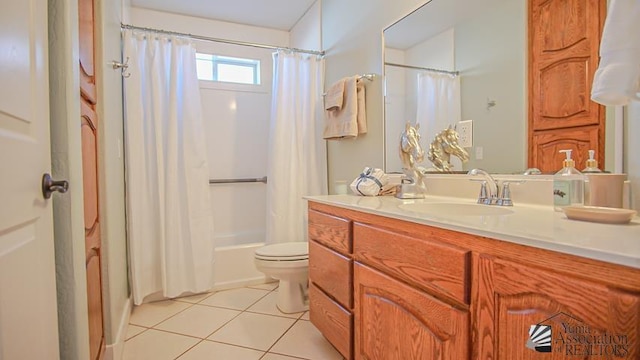 bathroom with toilet, shower / bath combo, vanity, and tile patterned flooring