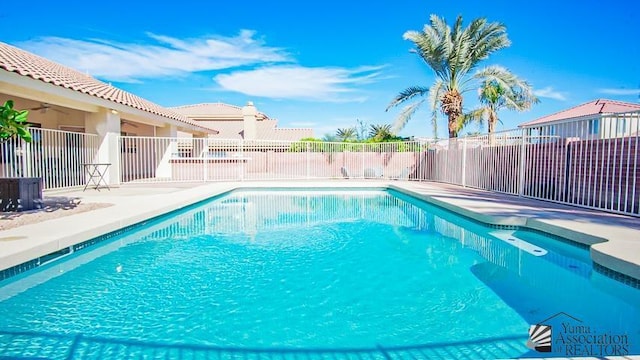 view of pool with a patio, fence, a fenced in pool, and ceiling fan