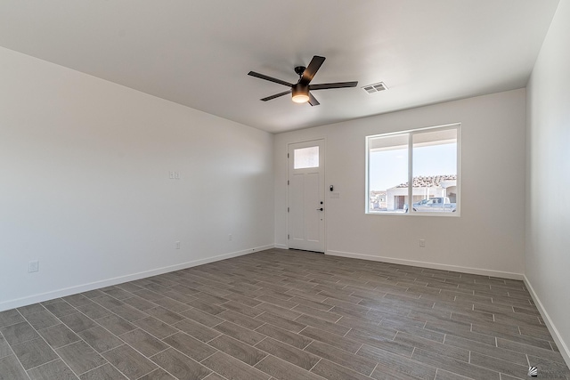 interior space with ceiling fan and dark wood-type flooring