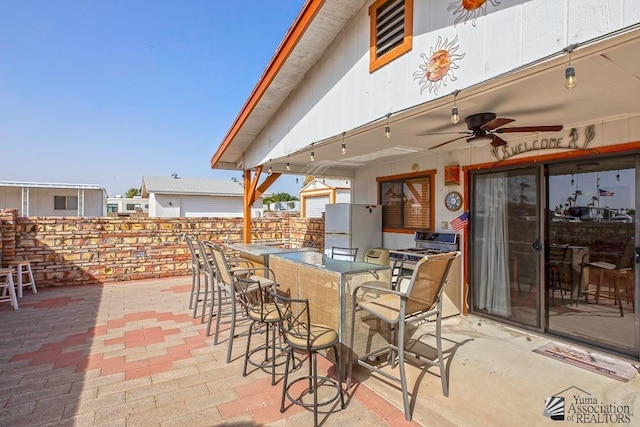 view of patio with an outdoor bar