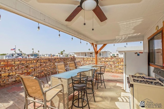 view of patio / terrace featuring an outdoor bar