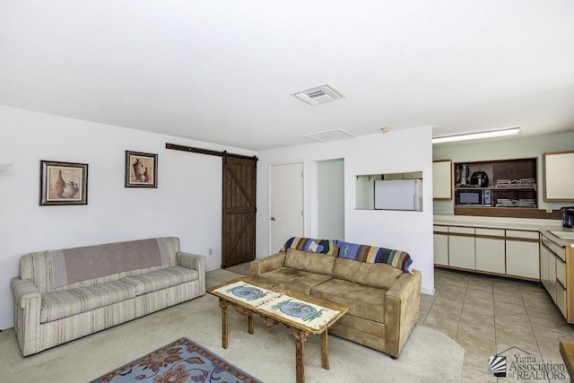 tiled living room with a barn door