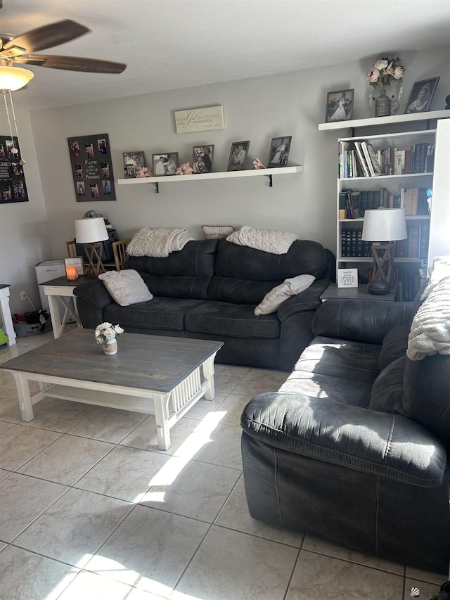 tiled living room with ceiling fan