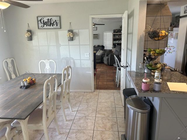 tiled dining room with ceiling fan and a wall unit AC