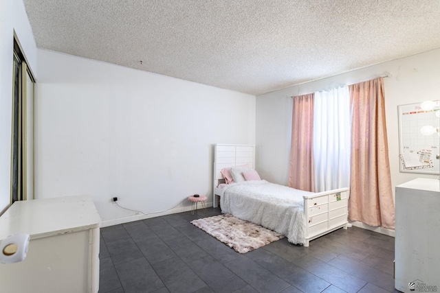 unfurnished bedroom featuring a textured ceiling