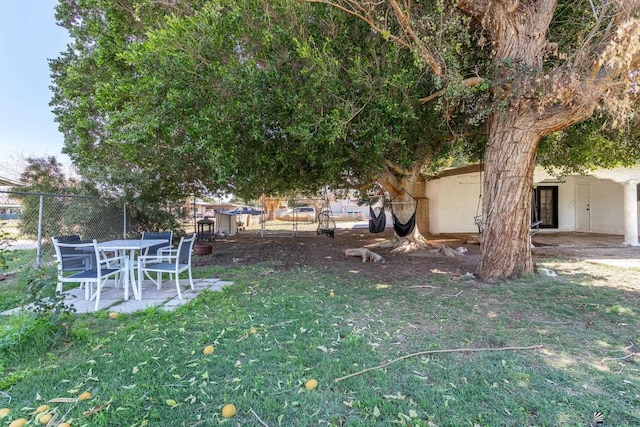 view of yard featuring a patio and fence