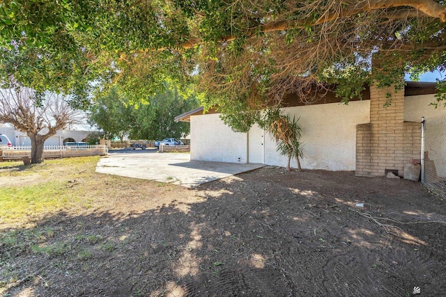 view of yard with a patio area and fence