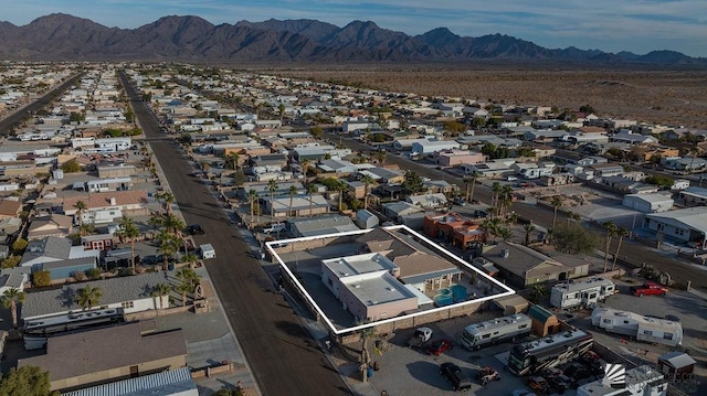 birds eye view of property with a mountain view