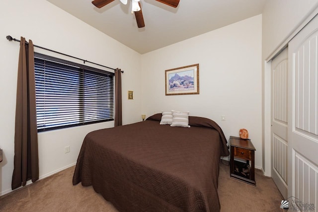 bedroom featuring light carpet, a closet, and ceiling fan