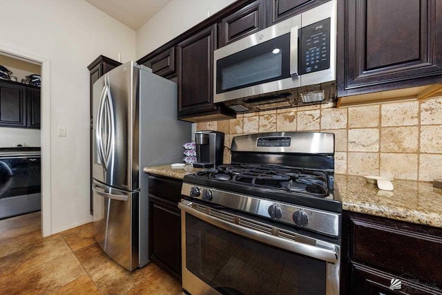 kitchen with tasteful backsplash, washer / dryer, stainless steel appliances, and dark brown cabinetry