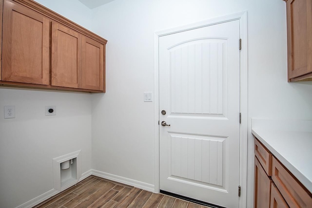 laundry room featuring cabinets and electric dryer hookup