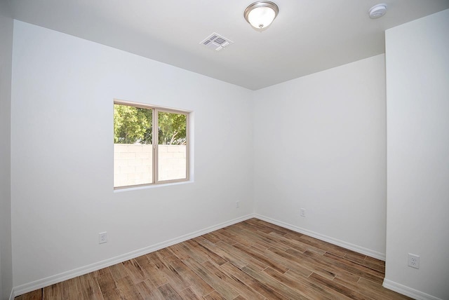 empty room with wood-type flooring