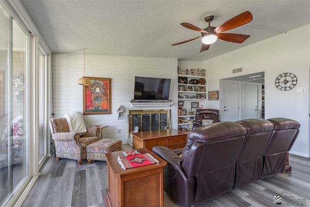 living room featuring hardwood / wood-style floors and a textured ceiling