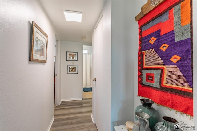 hallway with dark hardwood / wood-style floors