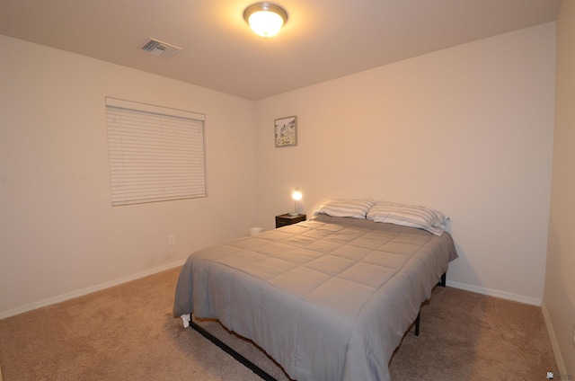 bedroom featuring visible vents, baseboards, and carpet flooring