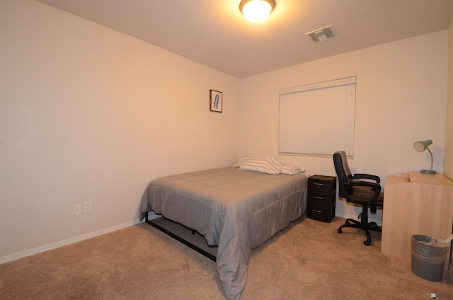 bedroom featuring visible vents, baseboards, and carpet floors