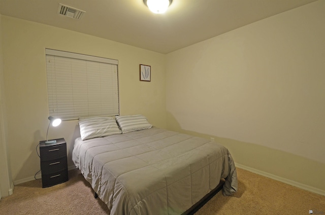 bedroom with visible vents, carpet floors, and baseboards