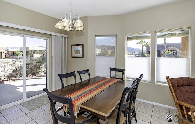 tiled dining area with a notable chandelier