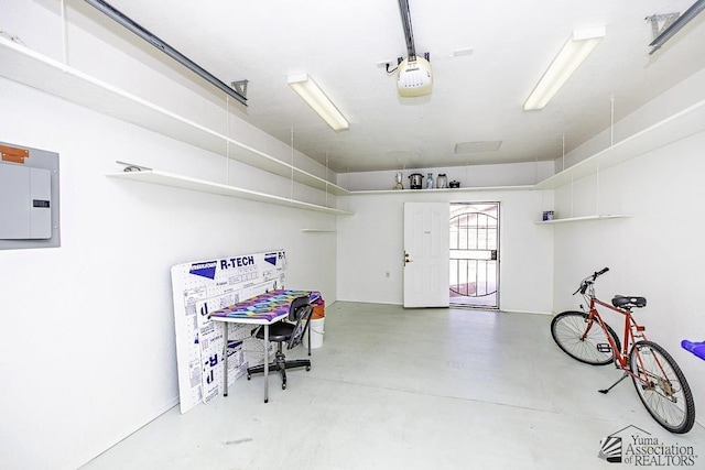 garage with electric panel and a garage door opener