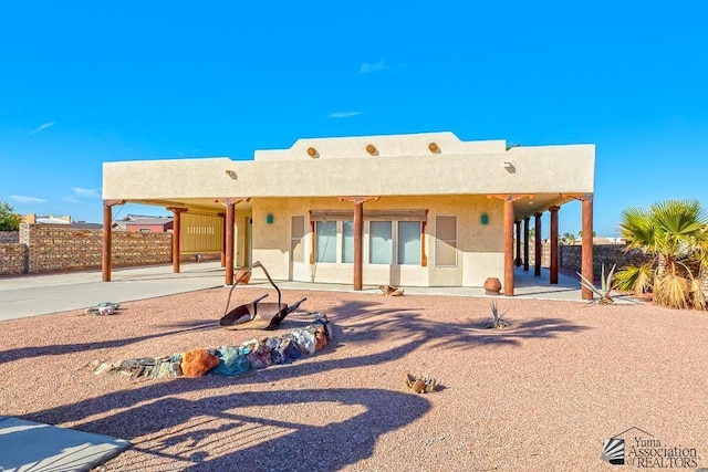 rear view of house featuring a patio