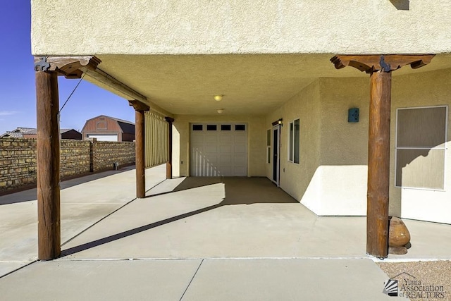 view of patio featuring a garage