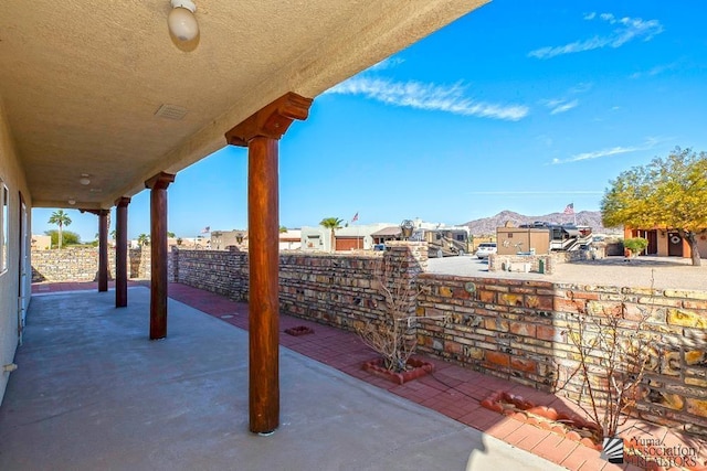 view of patio / terrace featuring a mountain view