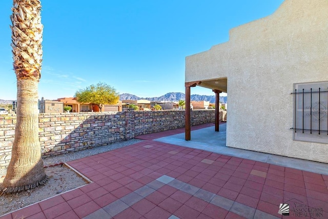 view of patio with a mountain view